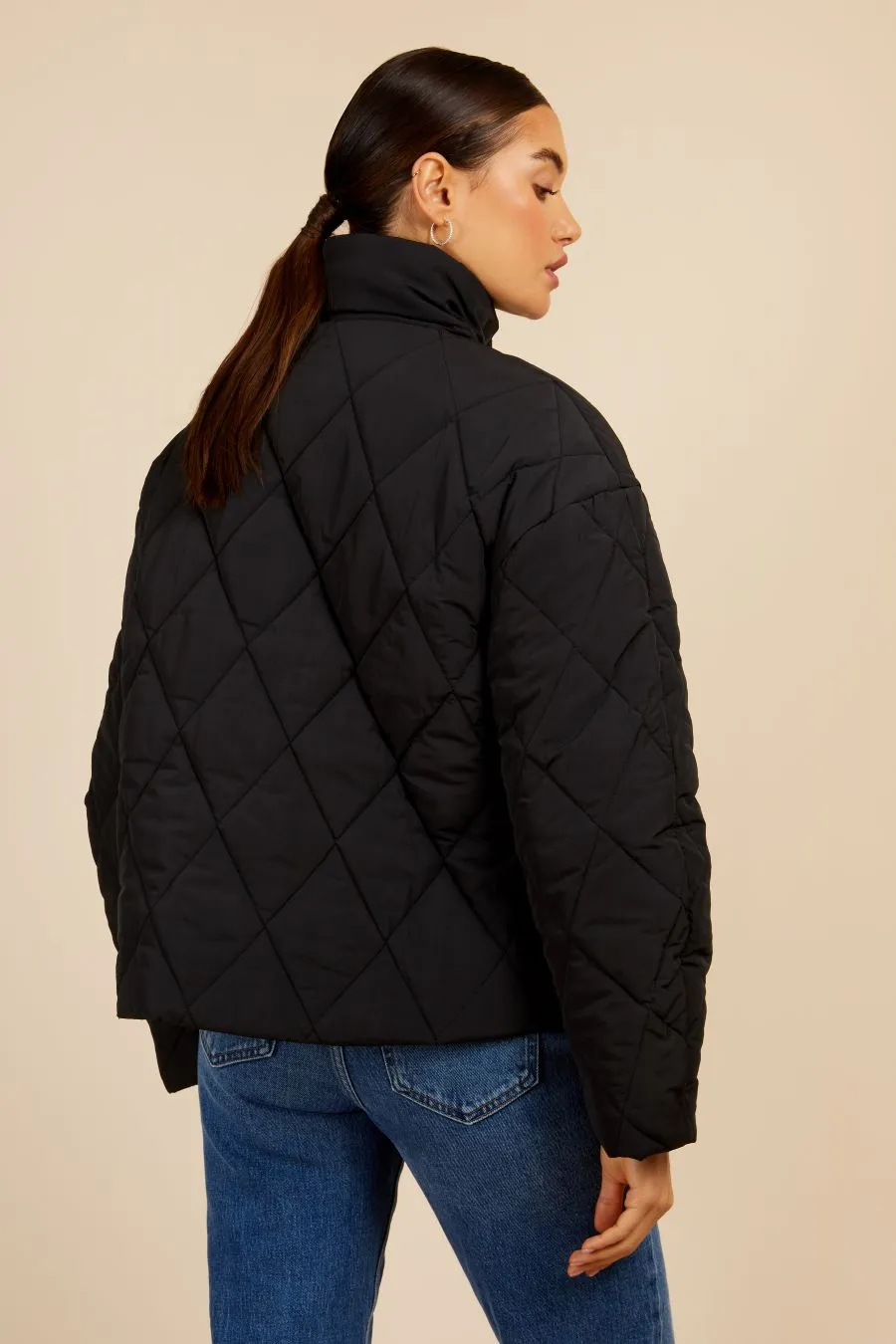 Black Quilted Puffer Jacket by Vogue Williams