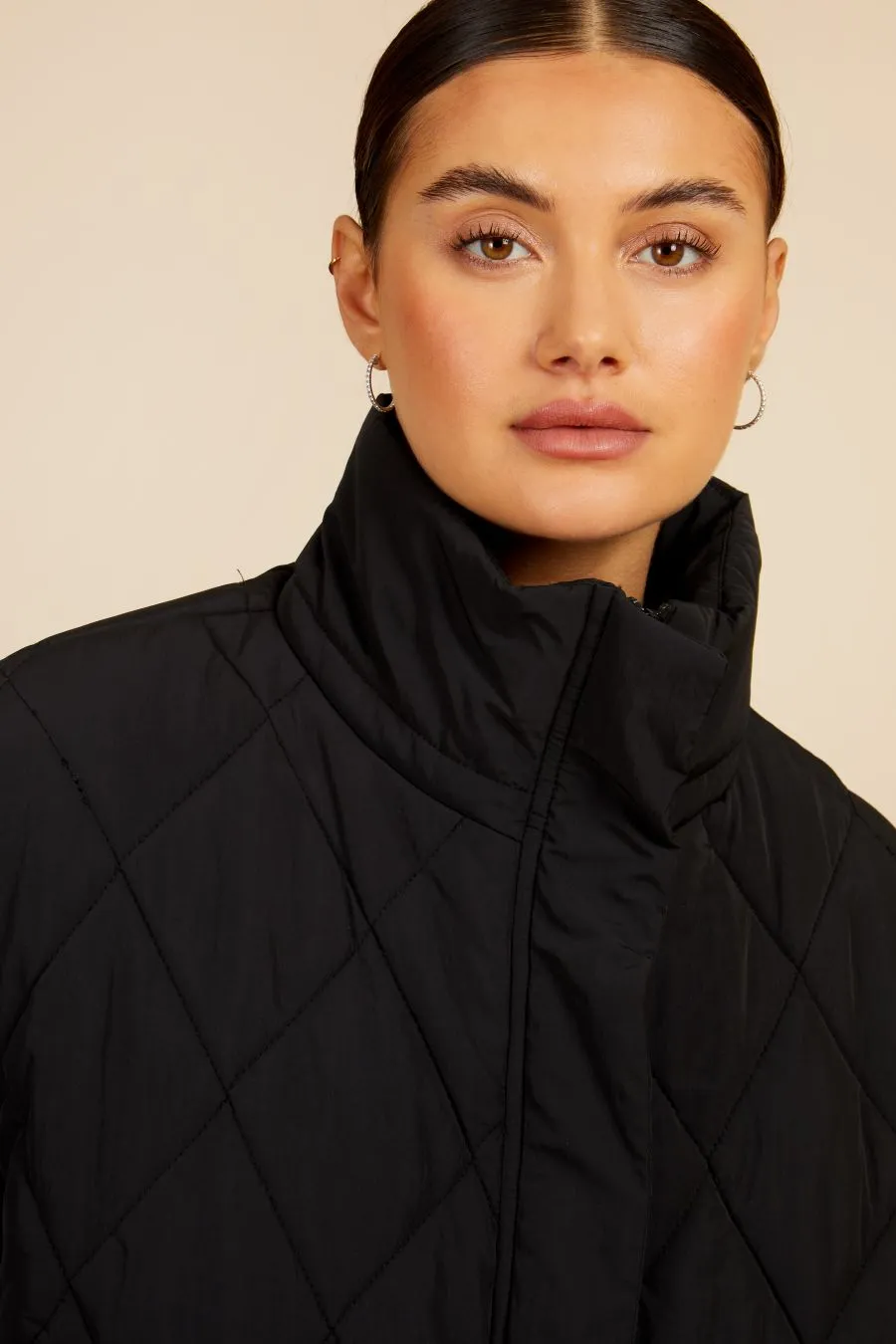 Black Quilted Puffer Jacket by Vogue Williams